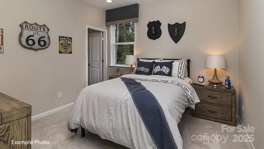 13420 Chopin Ridge Road Huntersville, NC 28078 - Photo 16 of 19 a bed room with a bed and a night stand