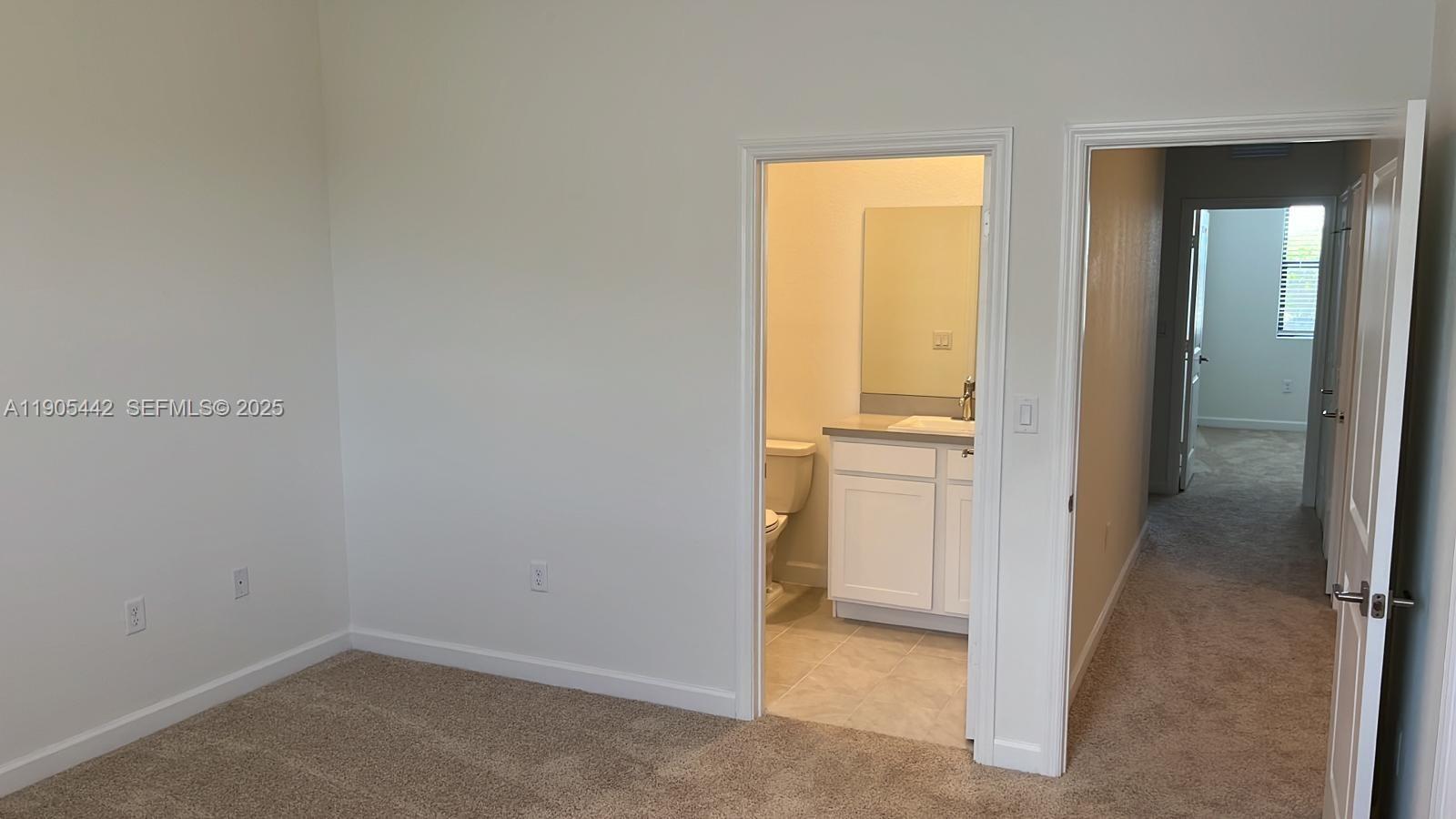 606 Southwest 12th Avenue Homestead, FL 33030 - Photo 12 of 20 an empty room and a hallway