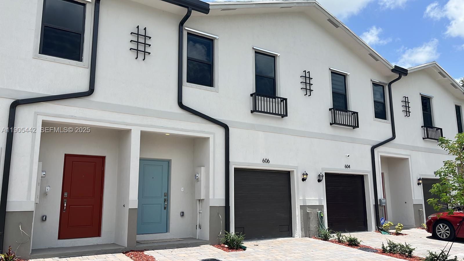 606 Southwest 12th Avenue Homestead, FL 33030 - Photo 2 of 20 a bathroom with a sink and a mirror