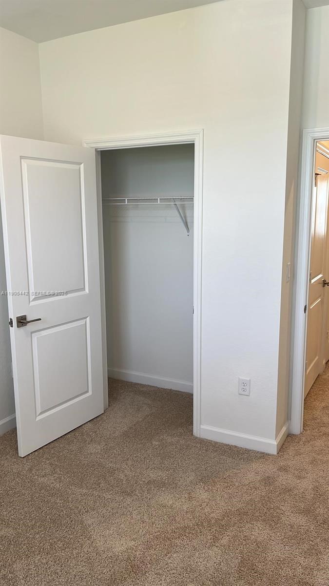 606 Southwest 12th Avenue Homestead, FL 33030 - Photo 6 of 20 an empty room with closet