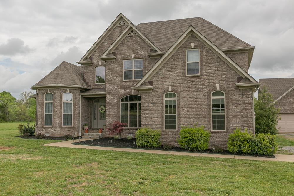 4703 Alsup Mill Road Lascassas, TN 37085 - Photo 1 of 30 a front view of a house with a yard