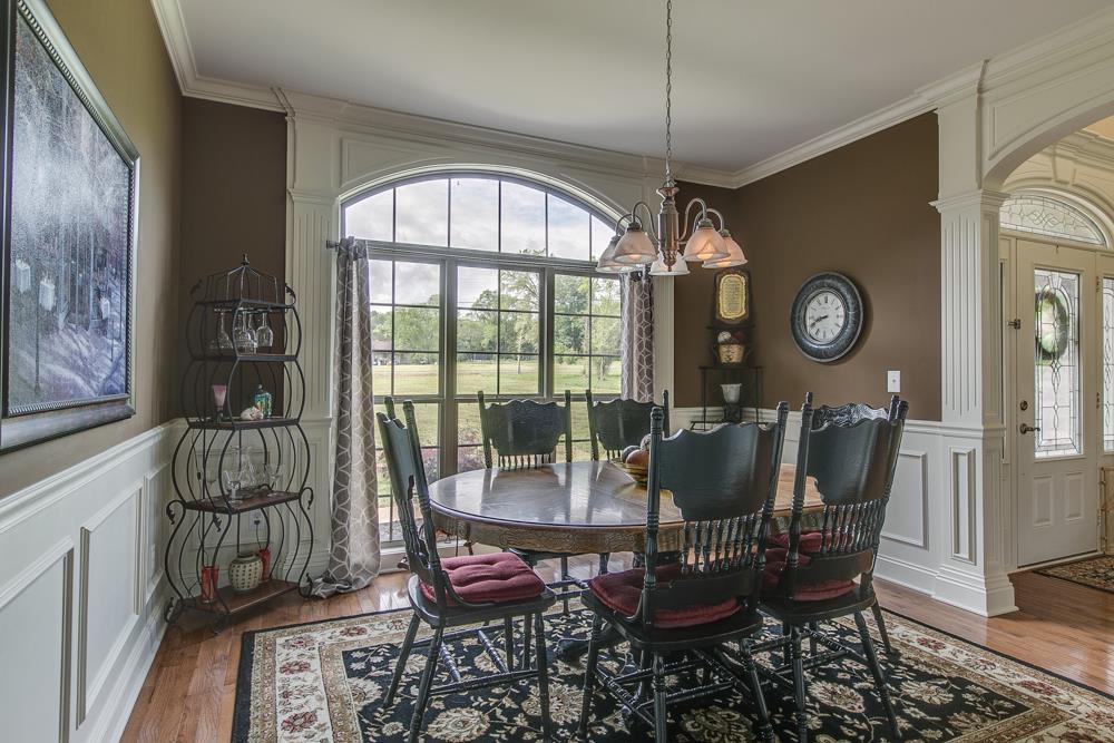4703 Alsup Mill Road Lascassas, TN 37085 - Photo 13 of 30 a dining room with furniture wooden floor and a chandelier
