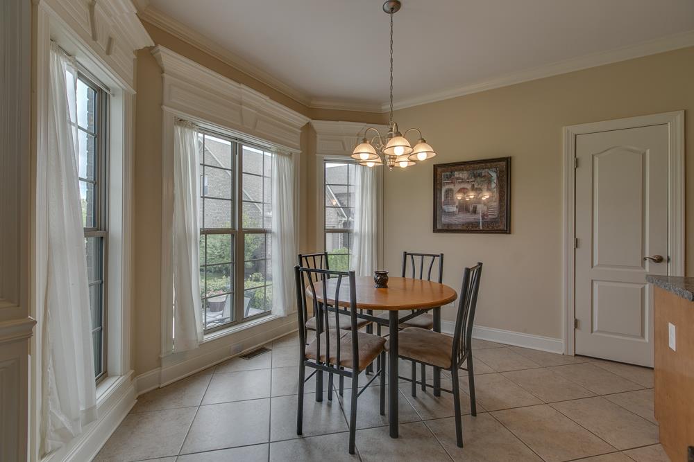4703 Alsup Mill Road Lascassas, TN 37085 - Photo 23 of 30 a dining room with furniture a chandelier and a rug