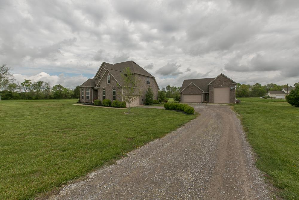 4703 Alsup Mill Road Lascassas, TN 37085 - Photo 5 of 30 a view of a house with a big yard and a large trees