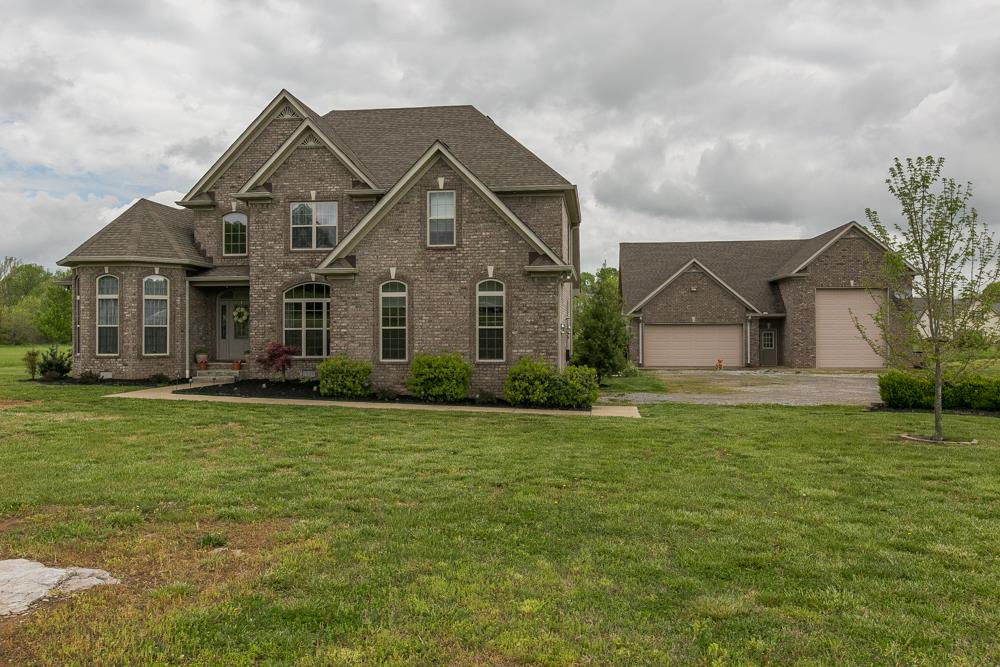 4703 Alsup Mill Road Lascassas, TN 37085 - Photo 8 of 30 a front view of a house with a yard