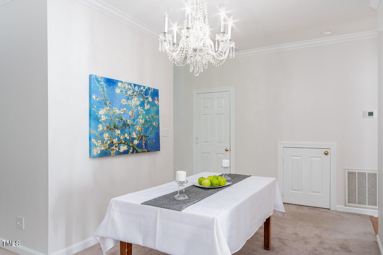 479 Beechmast Pittsboro, NC 27312 - Photo 11 of 22 a view of a dining room with a table and chairs