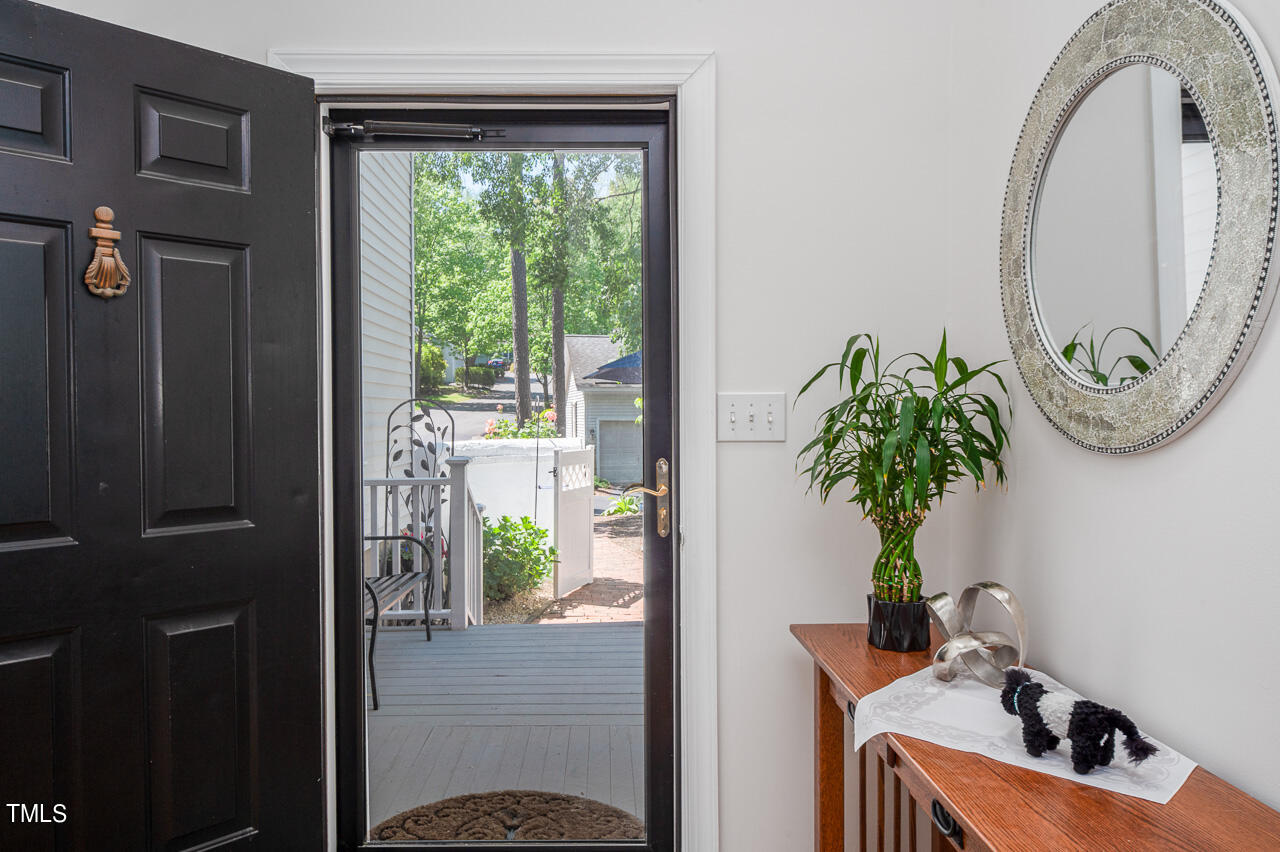 479 Beechmast Pittsboro, NC 27312 - Photo 5 of 22 a vase with flowers sitting on a table in front of a window