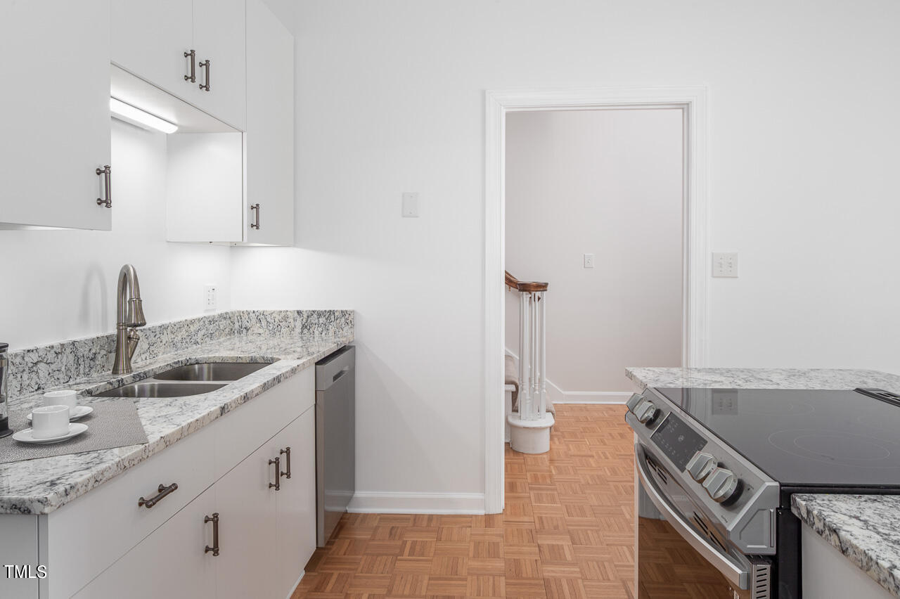 479 Beechmast Pittsboro, NC 27312 - Photo 9 of 22 a kitchen with a sink stove and cabinets