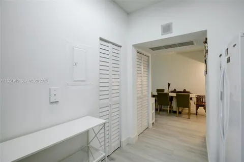 a view of a hallway with seating area