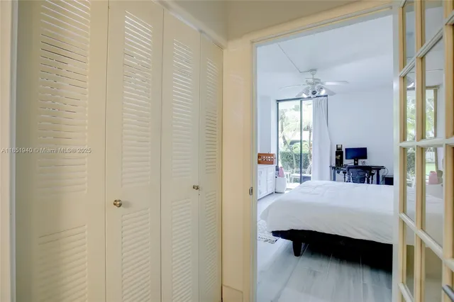 a bedroom with a bed and a table in it