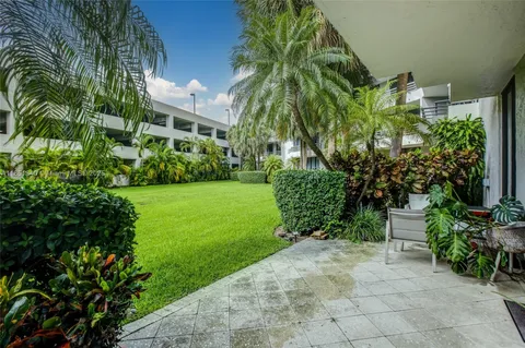 a view of a garden with a building