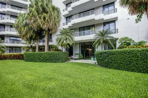 a view of a house with a yard and plants