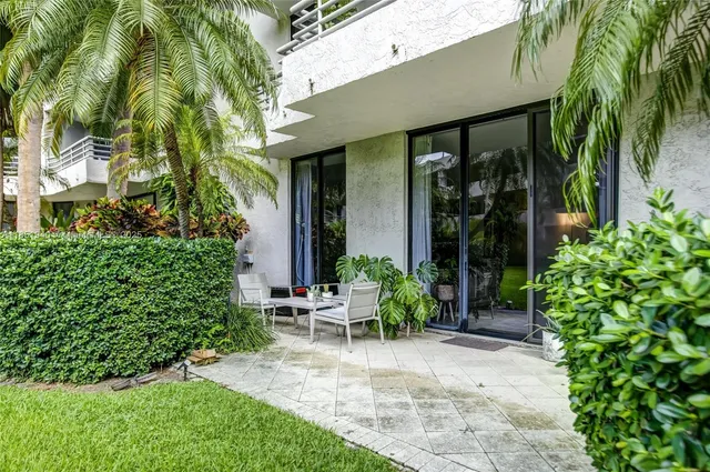 a view of an entrance to house with yard