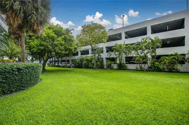 a view of a garden with a building