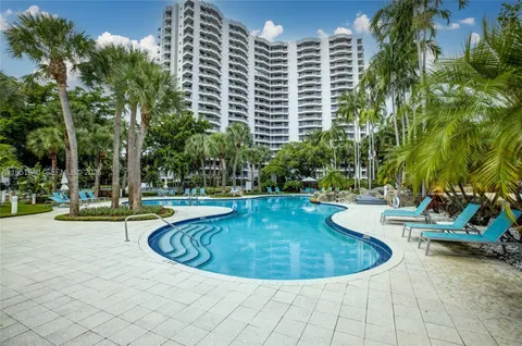 a view of a swimming pool with sitting area
