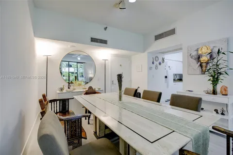 a living room with furniture and a mirror