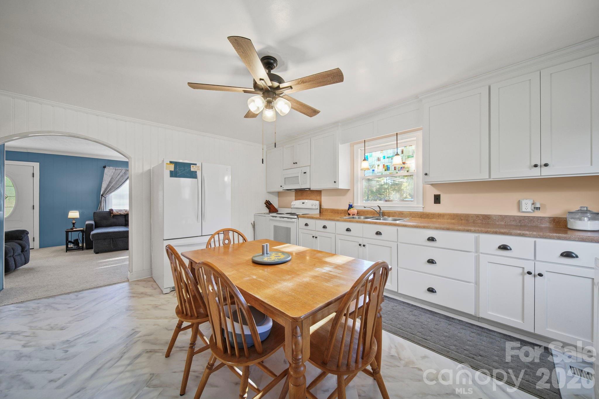 1787 St Johns Church Road Concord, NC 28025 - Photo 11 of 34 a view of a dining room with furniture and wooden floor