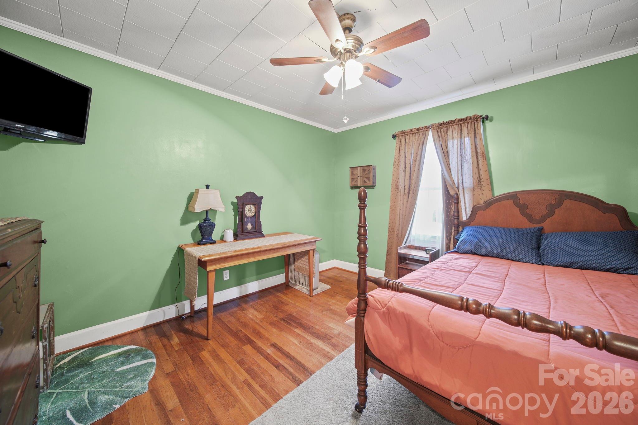 1787 St Johns Church Road Concord, NC 28025 - Photo 17 of 34 a bedroom with a bed and a flat screen tv