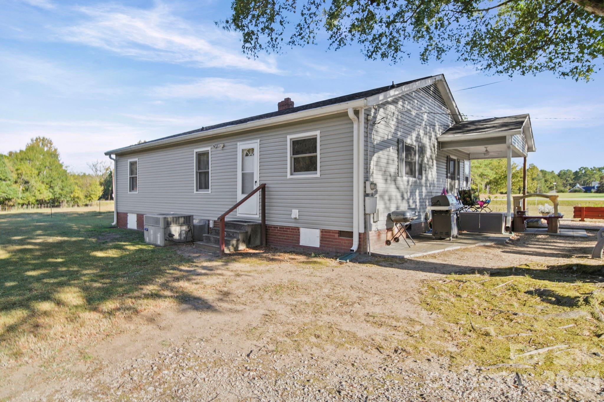 1787 St Johns Church Road Concord, NC 28025 - Photo 26 of 34 a view of a house with backyard and a yard