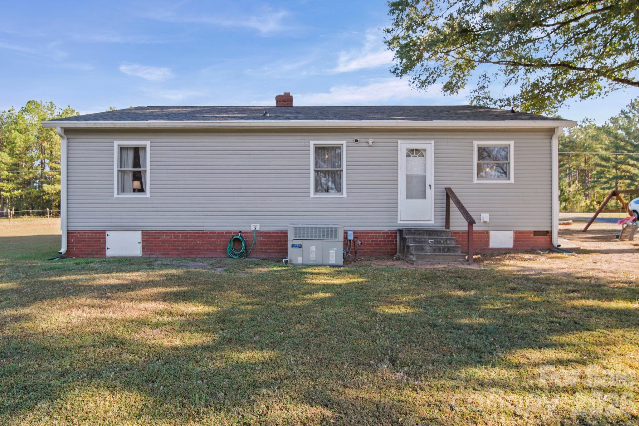 1787 St Johns Church Road Concord, NC 28025 - Photo 29 of 34 a view of a house with a yard