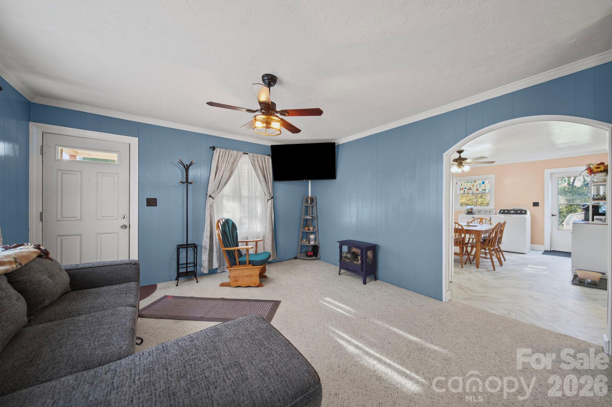 1787 St Johns Church Road Concord, NC 28025 - Photo 7 of 34 a living room with furniture and a chandelier