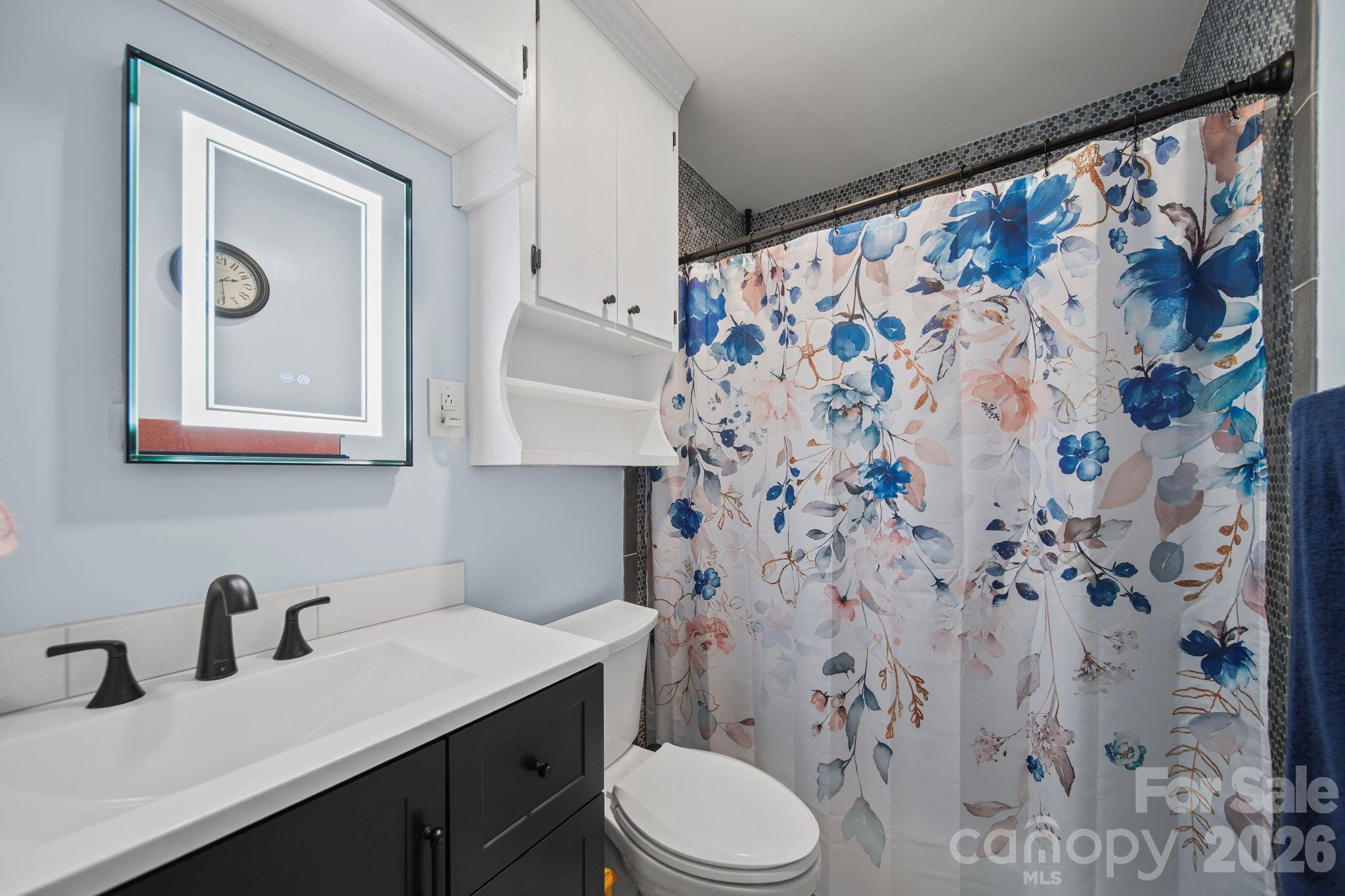 1787 St Johns Church Road Concord, NC 28025 - Photo 8 of 34 a bathroom with a sink toilet and shower