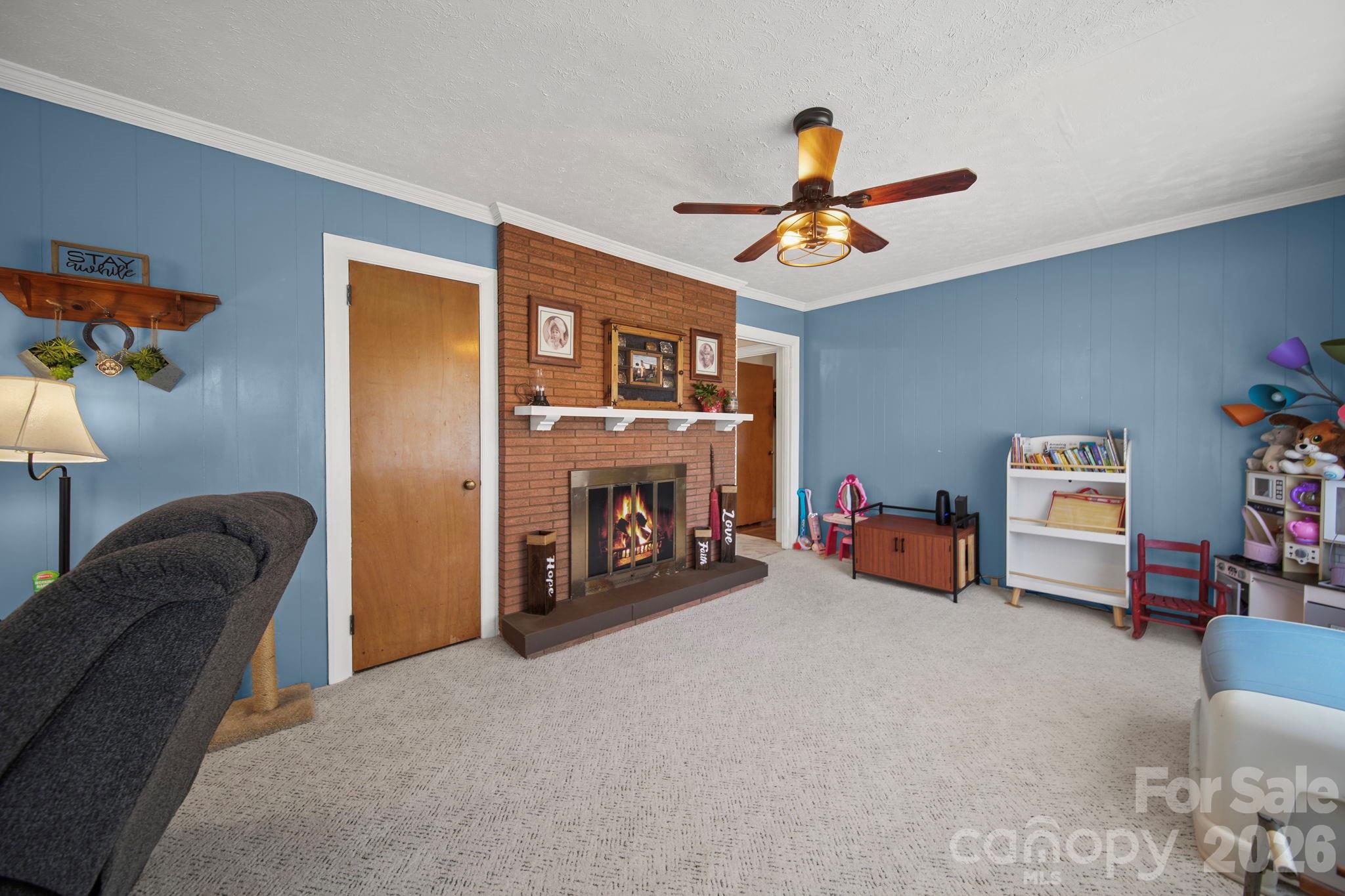1787 St Johns Church Road Concord, NC 28025 - Photo 9 of 34 a living room with furniture and a chandelier