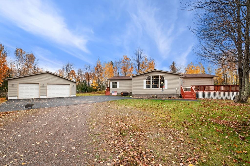 5251 Grabert Road Duluth, MN 55803 - Photo 1 of 50 Ranch-style home featuring an outbuilding, a detached garage, crawl space, a deck, and a front lawn
