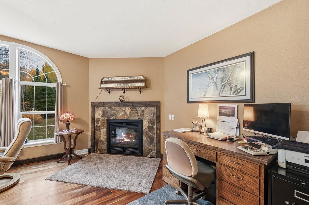 5251 Grabert Road Duluth, MN 55803 - Photo 17 of 50 Office space featuring wood finished floors and a fireplace