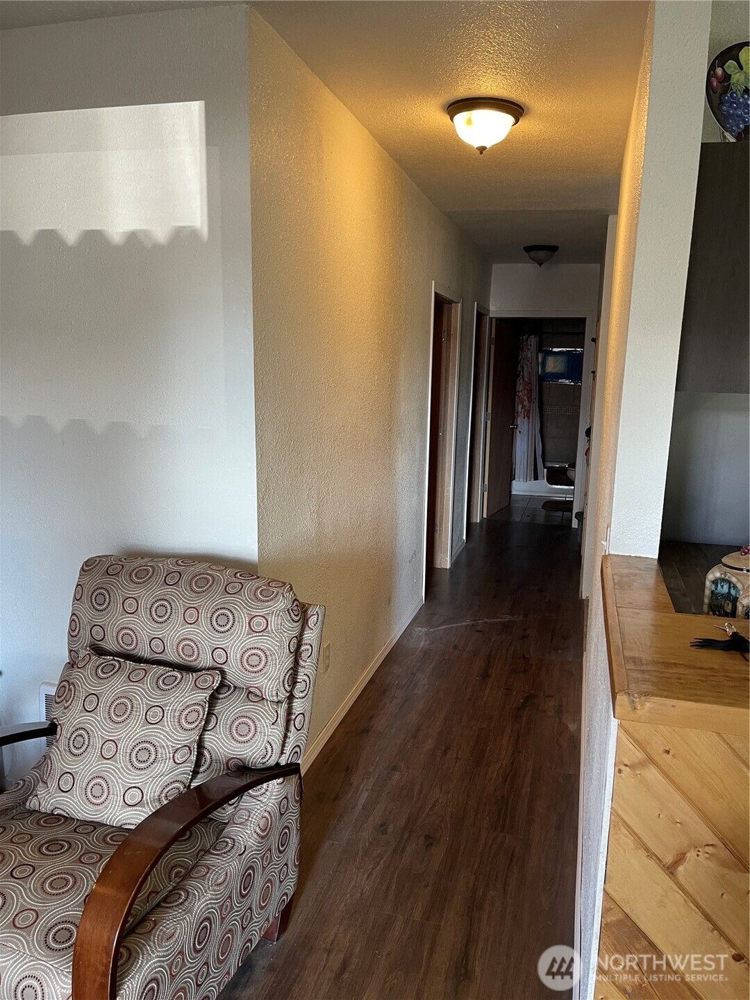 212 West 4th Street Tonasket, WA 98855 - Photo 11 of 24 a view of bedroom with furniture and wooden floor