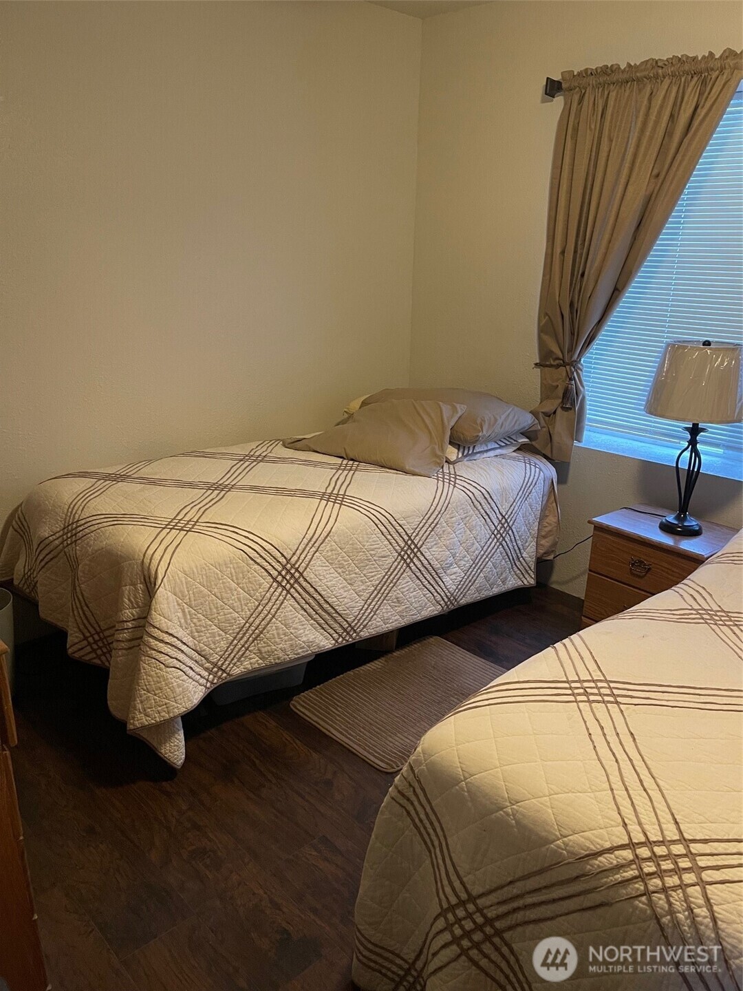 212 West 4th Street Tonasket, WA 98855 - Photo 12 of 24 a bedroom with two beds and a lamp