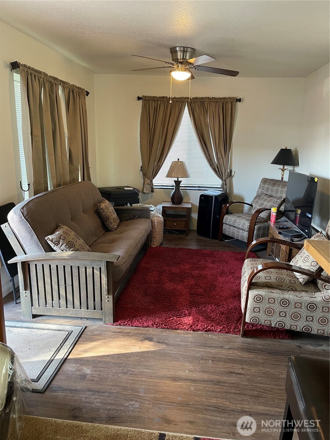 212 West 4th Street Tonasket, WA 98855 - Photo 2 of 24 a living room with furniture and a window