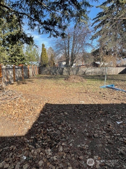212 West 4th Street Tonasket, WA 98855 - Photo 22 of 24 a view of a yard with large trees