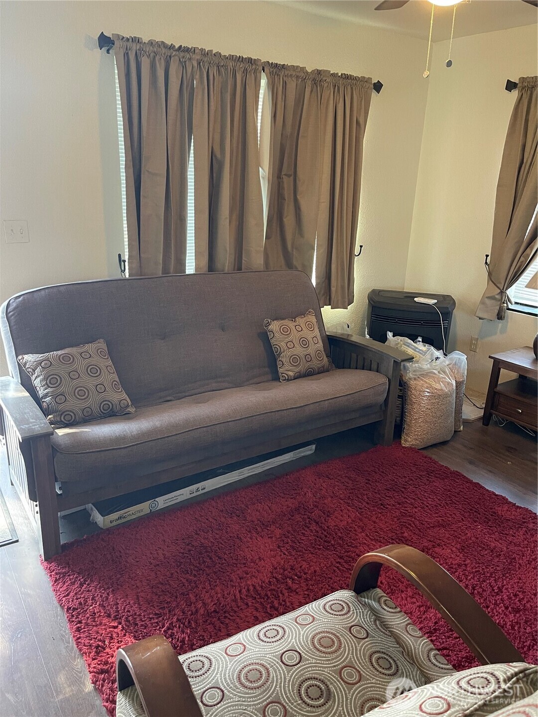 212 West 4th Street Tonasket, WA 98855 - Photo 3 of 24 a living room with furniture and a window