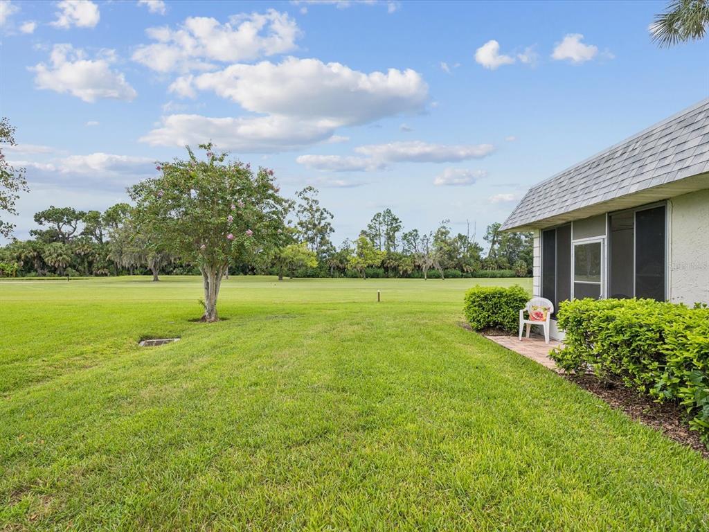 3683 Trophy Boulevard, Unit 7 New Port Richey, FL 34655 - Photo 19 of 42 a view of a garden with a slide