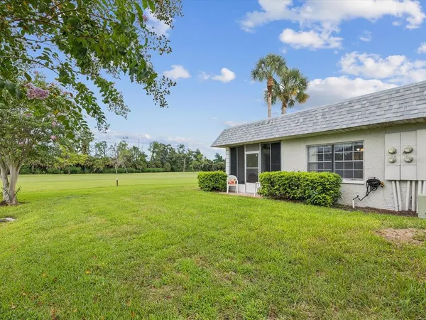 a view of a house with a yard