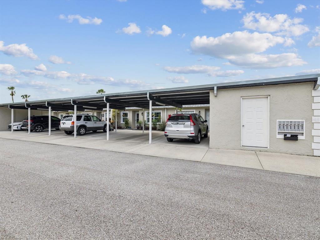 3683 Trophy Boulevard, Unit 7 New Port Richey, FL 34655 - Photo 23 of 42 a view of a car parked in front of a building
