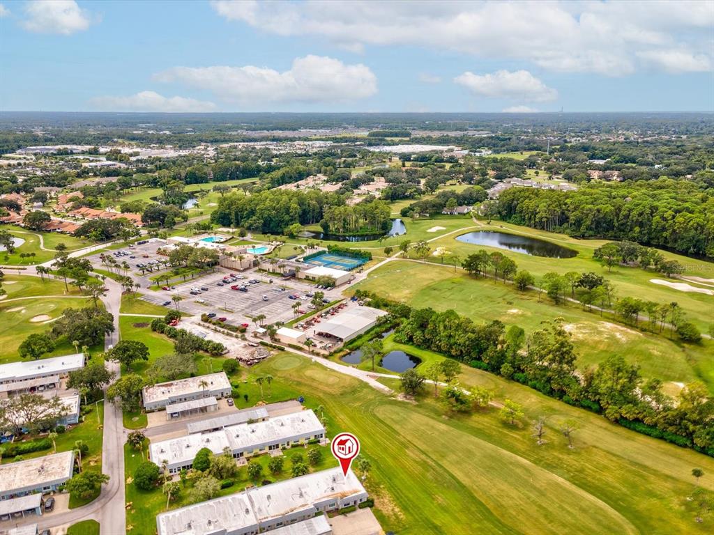 3683 Trophy Boulevard, Unit 7 New Port Richey, FL 34655 - Photo 25 of 42 an aerial view of residential houses with outdoor space
