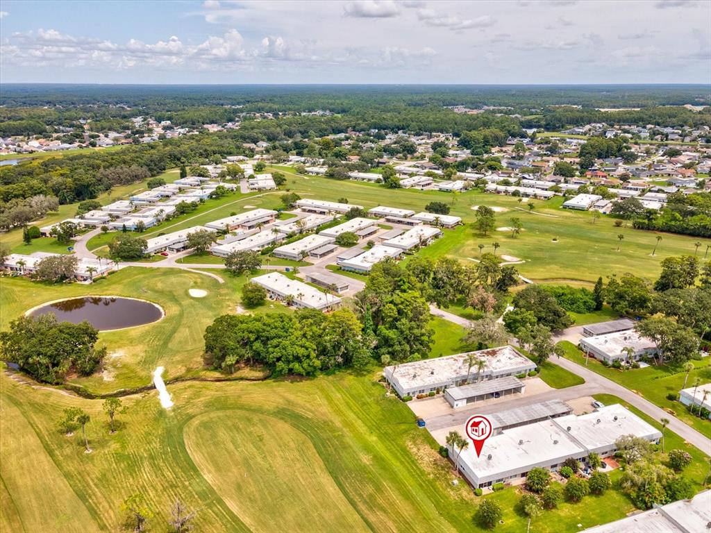 3683 Trophy Boulevard, Unit 7 New Port Richey, FL 34655 - Photo 27 of 42 an aerial view of residential houses with outdoor space