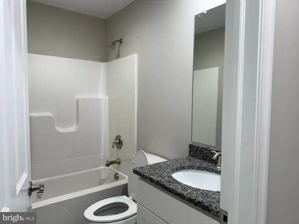 a view of backyard with tub