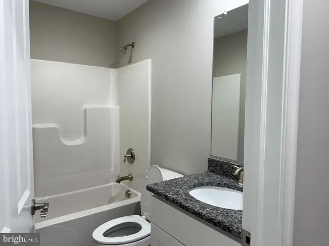 a view of backyard with tub