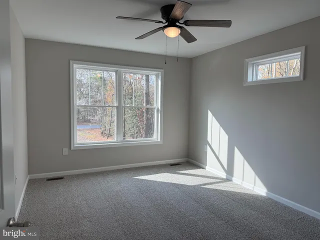 a view of a bathroom from the door