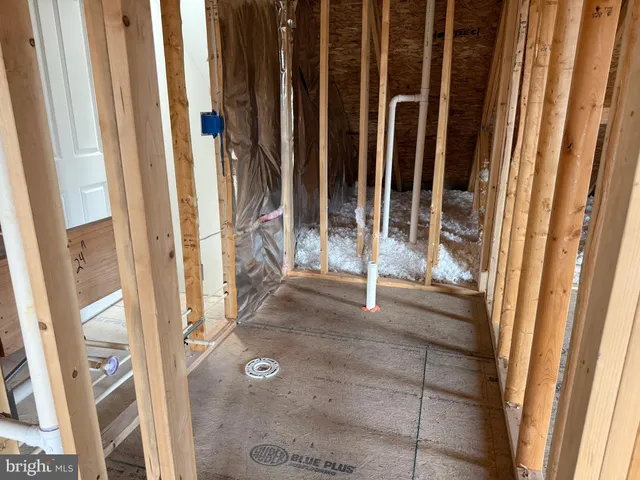 a view of an empty room with wooden walls