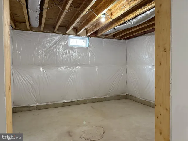 a view of an empty room with wooden walls