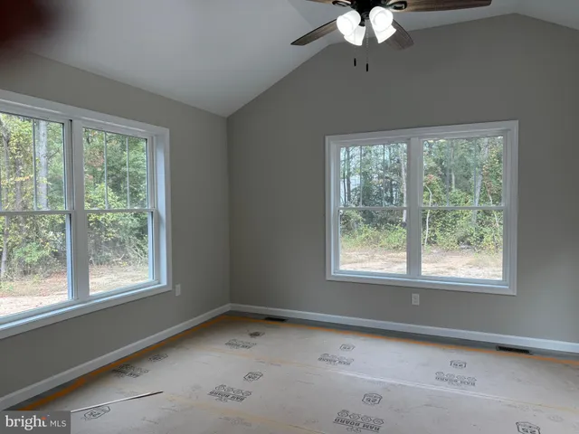 a kitchen with stainless steel appliances granite countertop a sink a refrigerator a stove a microwave and island