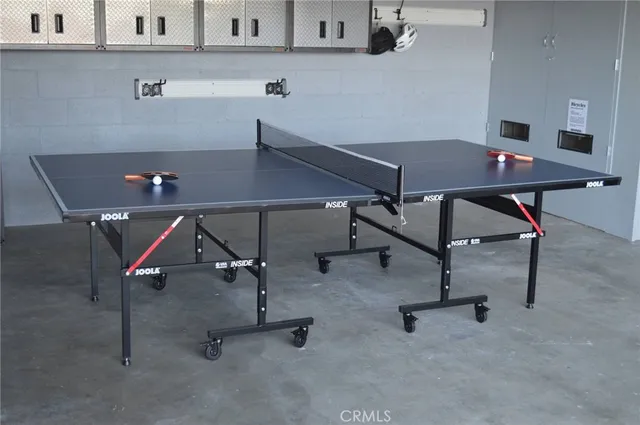 an aerial view of ocean with residential houses with outdoor space