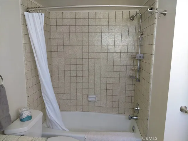 a bathroom with a shower and a bathtub