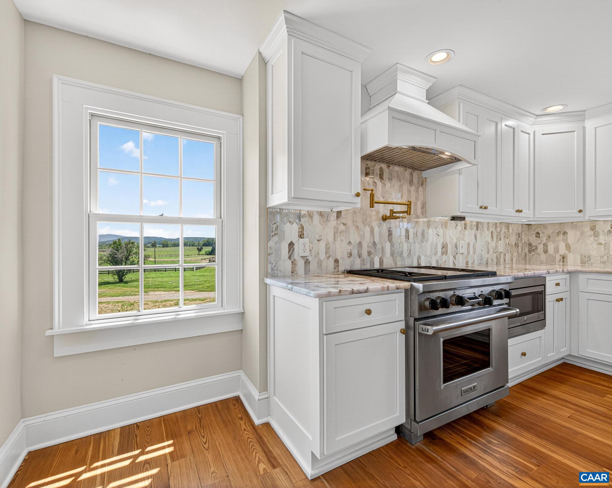 481 Race Ground Road Somerset, VA 22972 - Photo 17 of 53 a kitchen with a stove a sink and a window