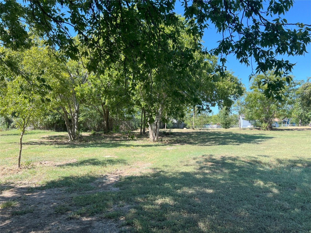 0 Madison Street Elgin, TX 78621 - Photo 5 of 9 a view of yard with swimming pool and trees