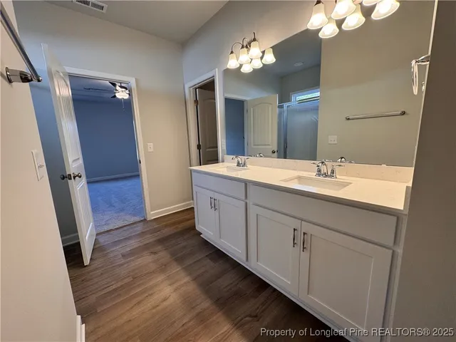 a bathroom with a glass shower door